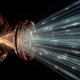 A single light beam splitting into multiple ultra-fast parallel lasers, representing parallel EVM explained and high-speed blockchain execution.